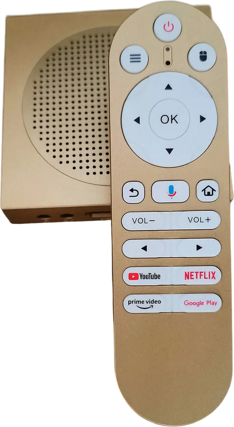 The Smart Stream TV Box in brushed gold, with its matching remote resting on top